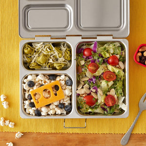 Full lunch salad popcorn tortellini packed in Launch Planetbox stainless steel zero-waste lunchbox. Shop reap and sow