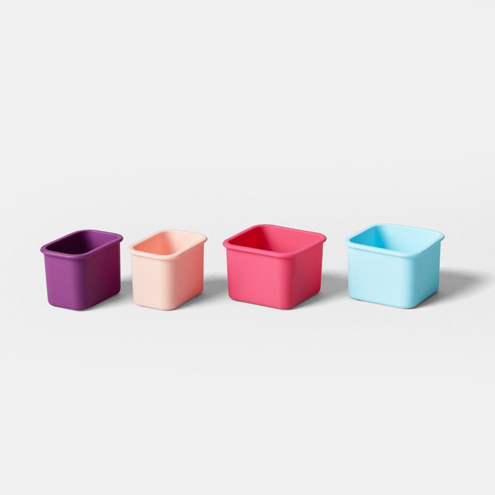 4 silicone snack pods that are meant to be used with planet box stainless steel lunchboxes - sprinkles purple, pink, light blue, coral