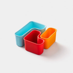3 puzzle pods silicone snack pods fit together like a puzzle that are meant to be used with planet box stainless steel lunchboxes orange red light blue