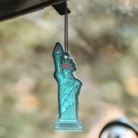 Statue of liberty in turquoise darker background scented with warm rain, sea salt and wildflowers by Good & Well at Shop Reap & Sow 