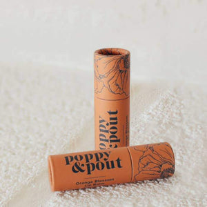 Orange Blossom Poppy & Pout Lip Balm in Orange zero-waste packaging. Reap & Sow Zero Waste DIY Refillery