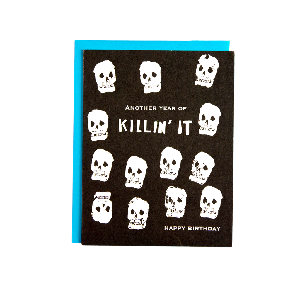 Another year of killing it happy Birthday card. Black background card with white skulls by Amador collective at reap & sow