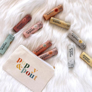 10 flavors Poppy + Pout plant-based lip balm in zero-waste packaging!  Matching vanity bag with multi-color logo