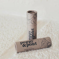 Island Coconut Poppy & Pout Lip Balm in Grey zero-waste packaging. Reap & Sow Zero Waste DIY Refillery